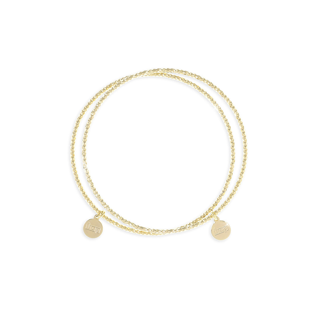 Bracciale Rigido UNOAERRE in Bronzo Dorato – Finitura Diamantata, Design Tubo Battuto